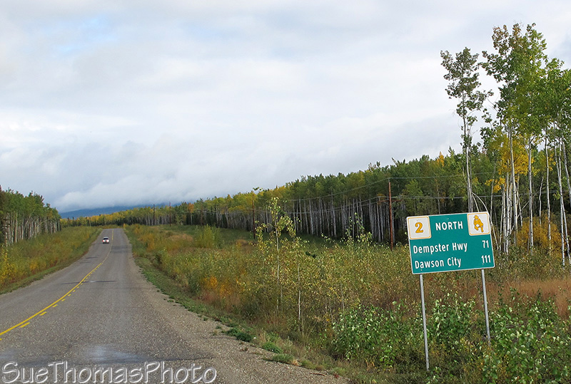 Distance sign to Dawson City