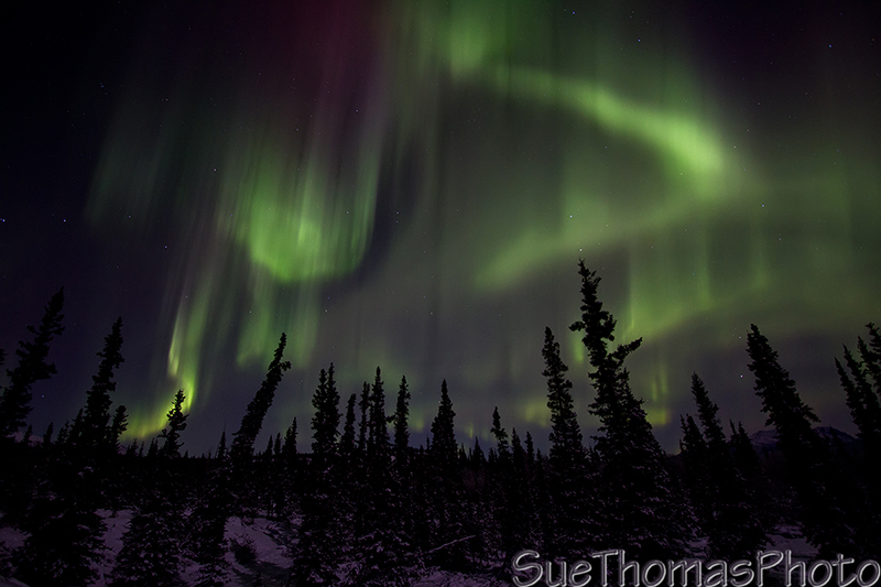 Aurora over the hills to the north