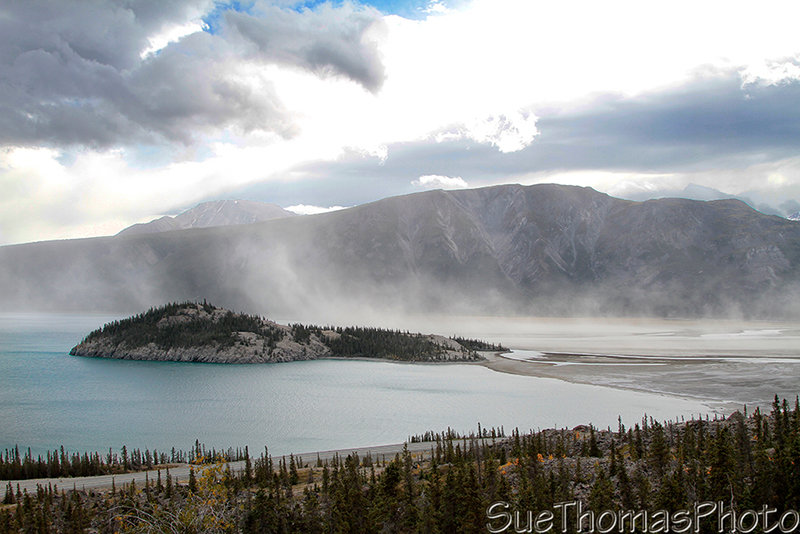 The island in Kluane Lake with a dust storm